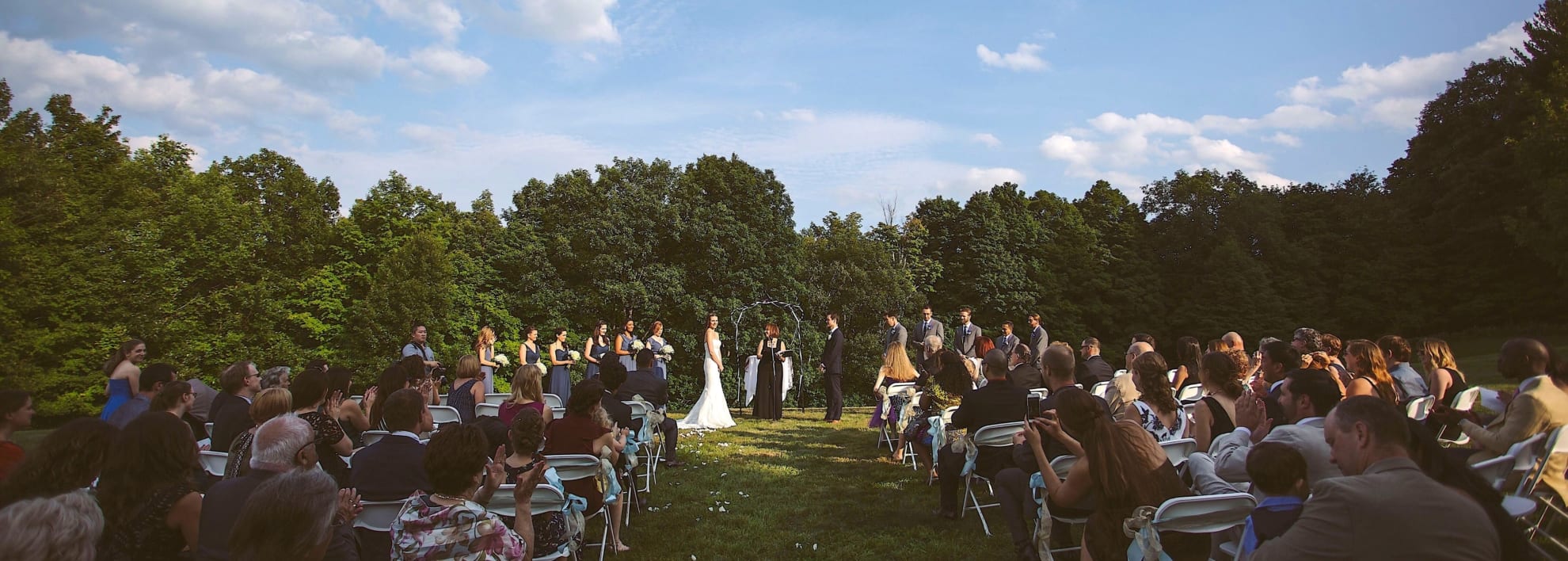 Panorama of outdoor wedding ceremony.