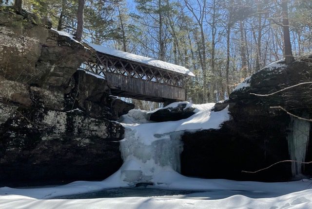 Frozen waterfalls with covered bridge