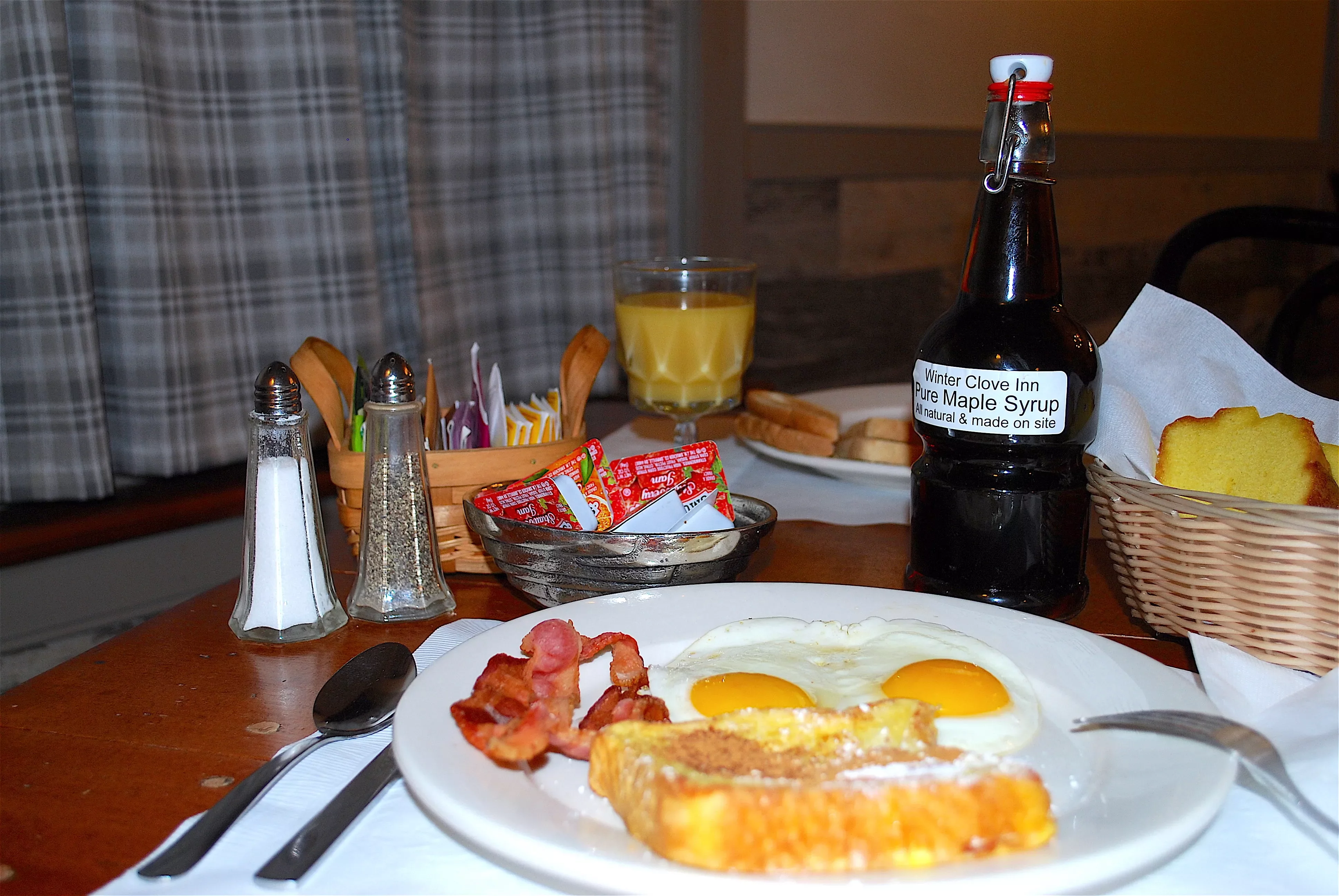 CountryBreakfast Full country breakfast with eggs, french toast, and syrup.